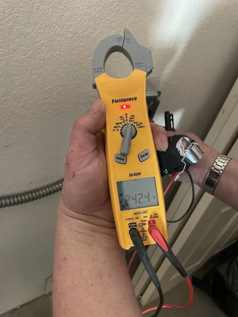 Voltage testing with clamp meter during Whole House Surge Protector in Kenilworth